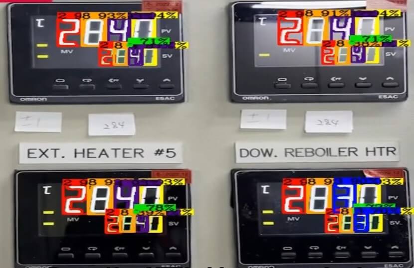 Close-up of digital gauge meters displaying readings with an OCR overlay for automated text recognition and data extraction.