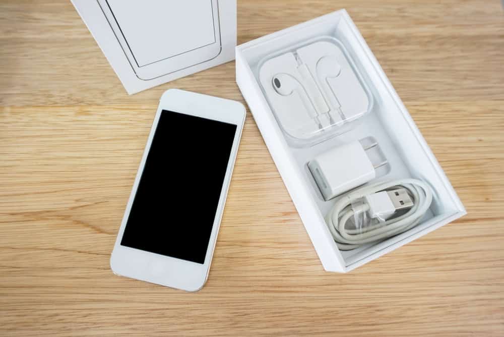 smartphone package with accessories on a wooden table background